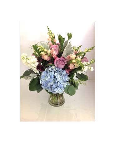 Sophisticated Touch - Elegant &amp; graceful arrangement of soft colors that make anyone go WOW. Hydrangeas, roses, snapdragons, buttons and soft greenery.  Flowers and colors may vary depending on availability.   FCF-066