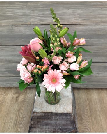Pink mixed bouquet in a clear glass vase