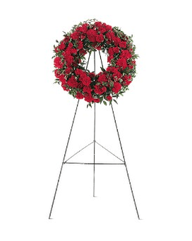 Red floral wreath on a metal easel