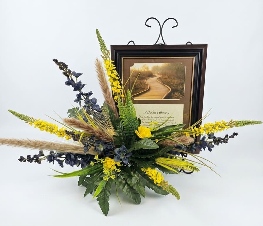 A Brother's Memory Framed Print with Silk Flowers - A Brother's Memory Framed Print with Silk Flowers is a wonderful gift to give to a loved one in loss of their brother. Frame feature's a velvet easel back and a triangle hanger. Personalization is possible by swapping out the artwork for a 4" x 6" photograph if you would like a personalized look. Comes on a tabletop black easel and silk floral arrangement.    W: 10" H: 12"