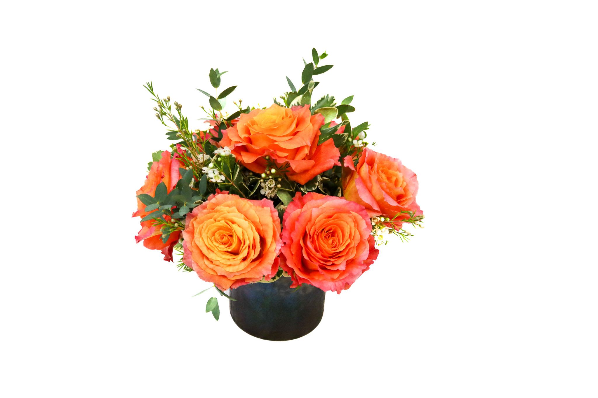 Orange rose arrangement in a black vase