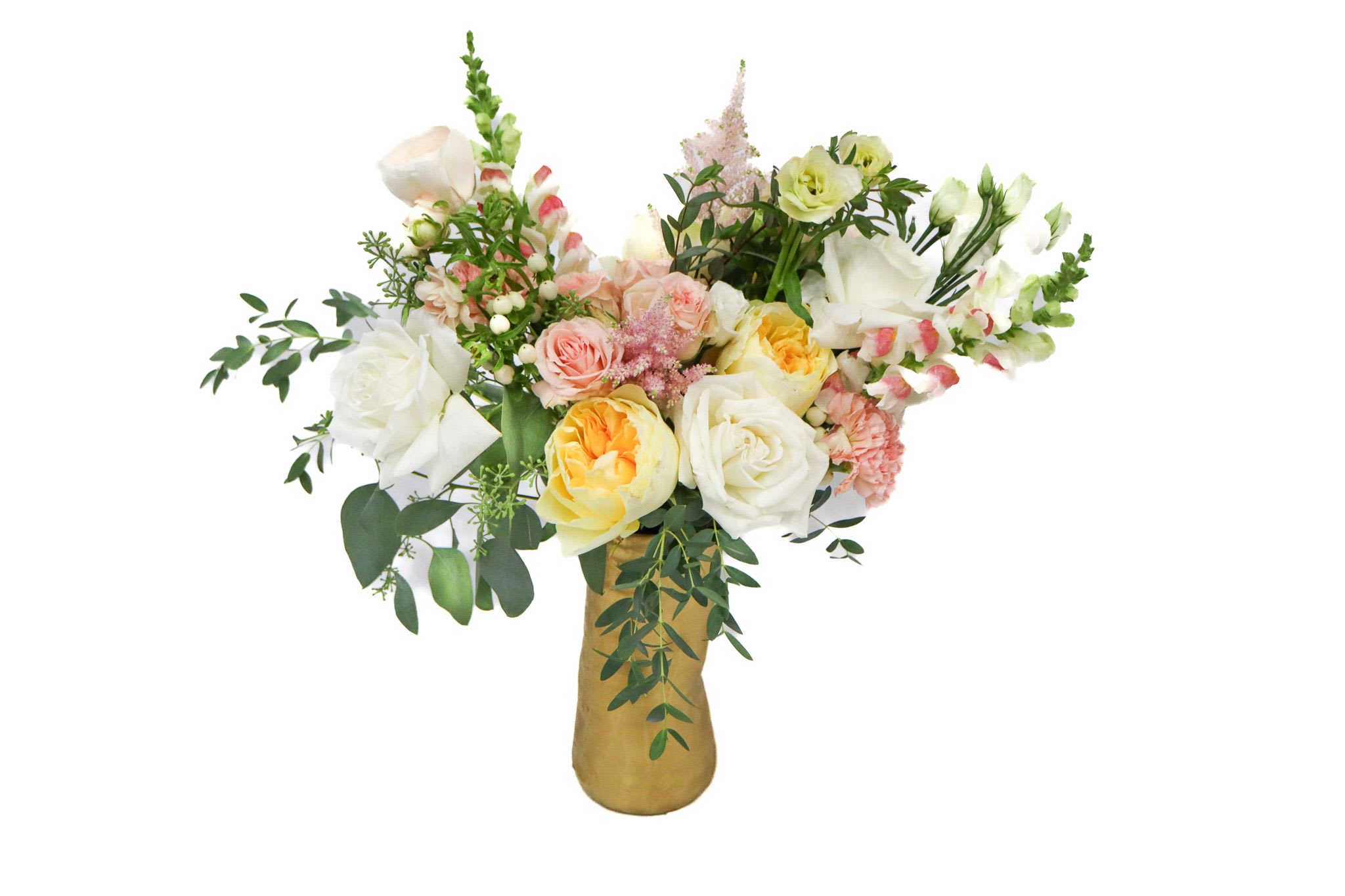 Mixed bouquet of white, pink, and yellow flowers in a gold vase