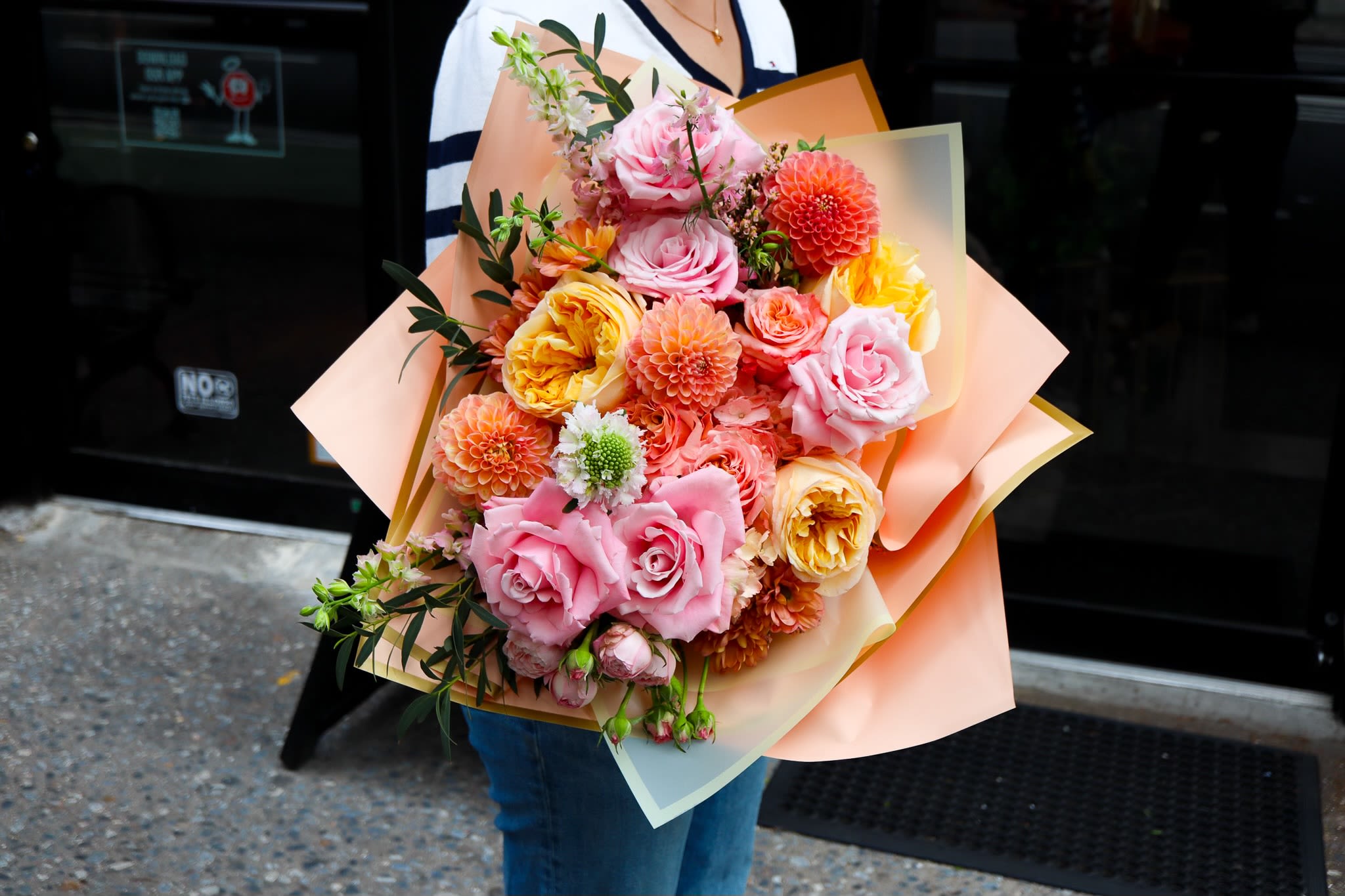 Summer Dream - Summer Dream Vibes Hand Bouquet Bring a splash of sunshine to any occasion with this vibrant summer-inspired bouquet! Featuring cheerful dahlias, delicate roses, and seasonal blooms in soft peach, coral, and blush tones, it’s the perfect way to celebrate summer. Wrapped beautifully and ready to gift — please note, this bouquet does not come in a vase.
