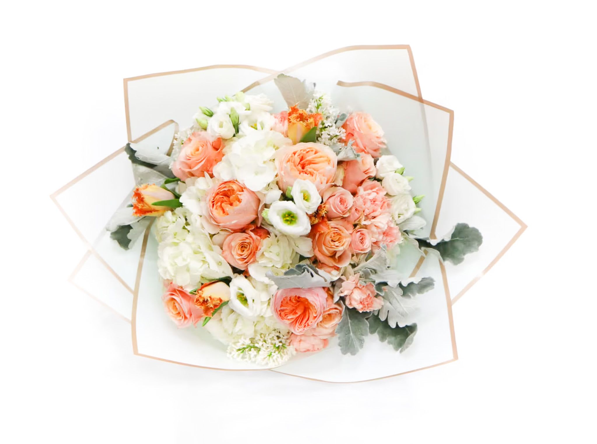 Savannah - Radiating warmth and elegance, this handcrafted bouquet features lush peach garden roses, soft ivory hydrangeas, delicate white lisianthus, and textured seasonal blooms accented with silvery greenery. The rich peach tones bring a romantic glow, while the creamy whites create balance and softness, resulting in a bouquet that feels both fresh and timeless.  Designed in a modern, layered wrap, this arrangement has a full, luxurious shape with natural movement and airy texture—perfect for gifting, weddings, anniversaries, or brightening any space with a touch of refined beauty.  Each bouquet is thoughtfully arranged using premium, fresh flowers to ensure a stunning presentation and long-lasting enjoyment.
