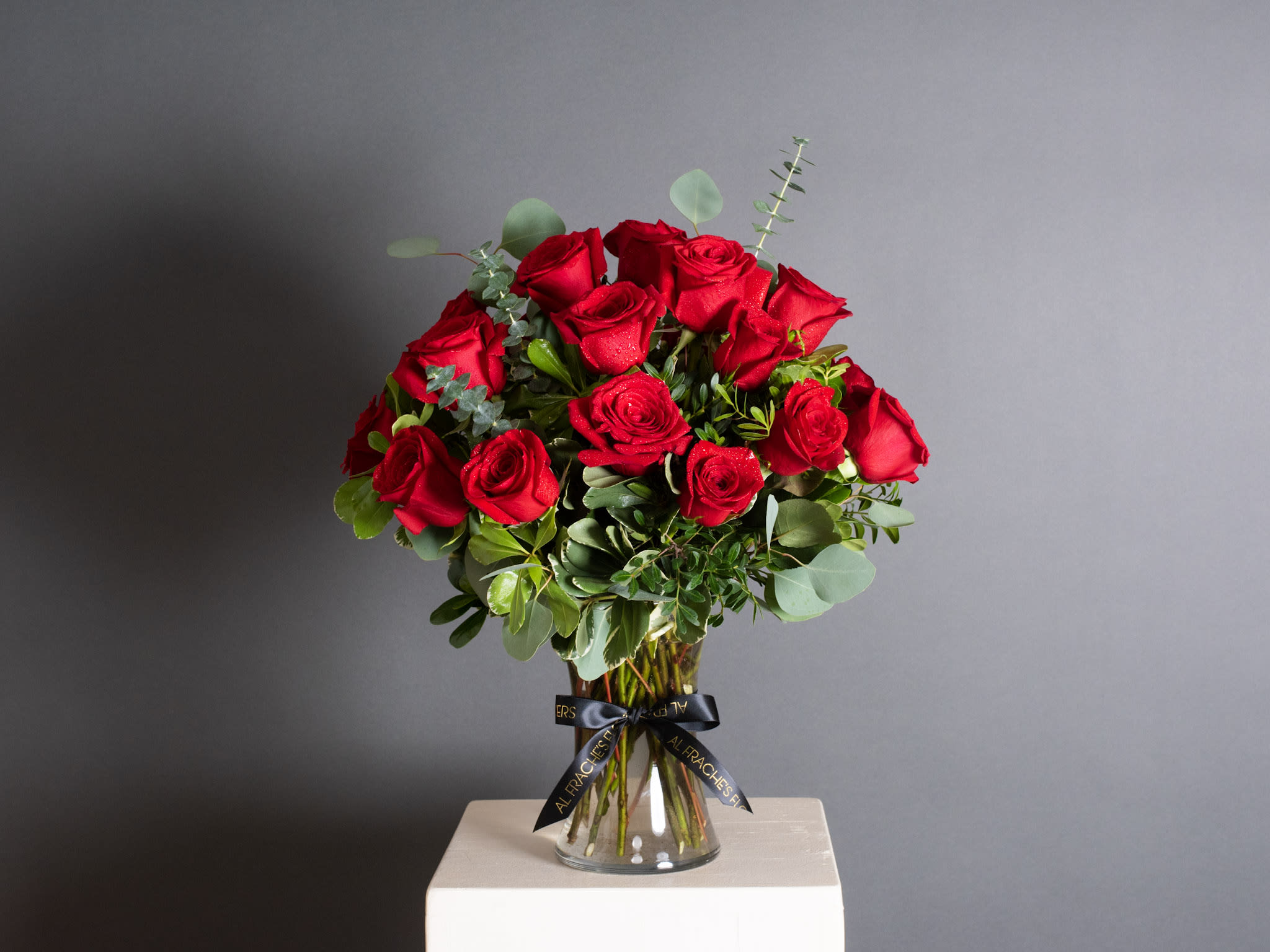 Bouquet of red roses in a clear glass vase