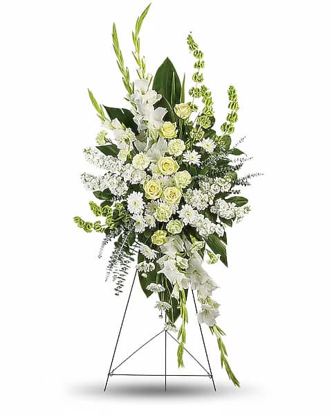 Tall white and pale green standing floral spray on an easel