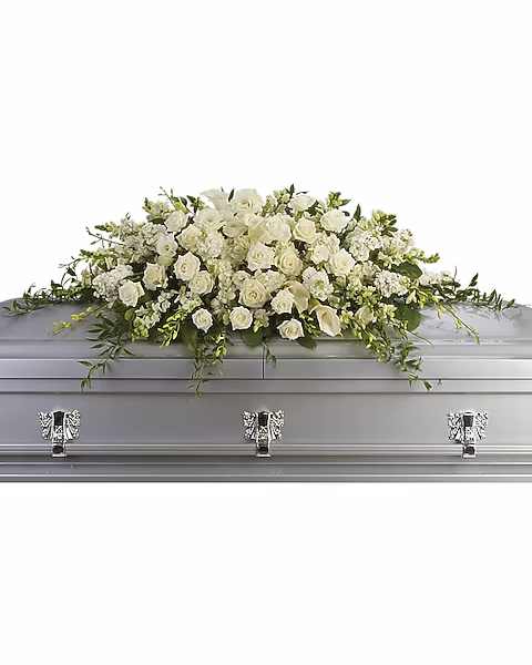White floral casket spray with roses and calla lilies