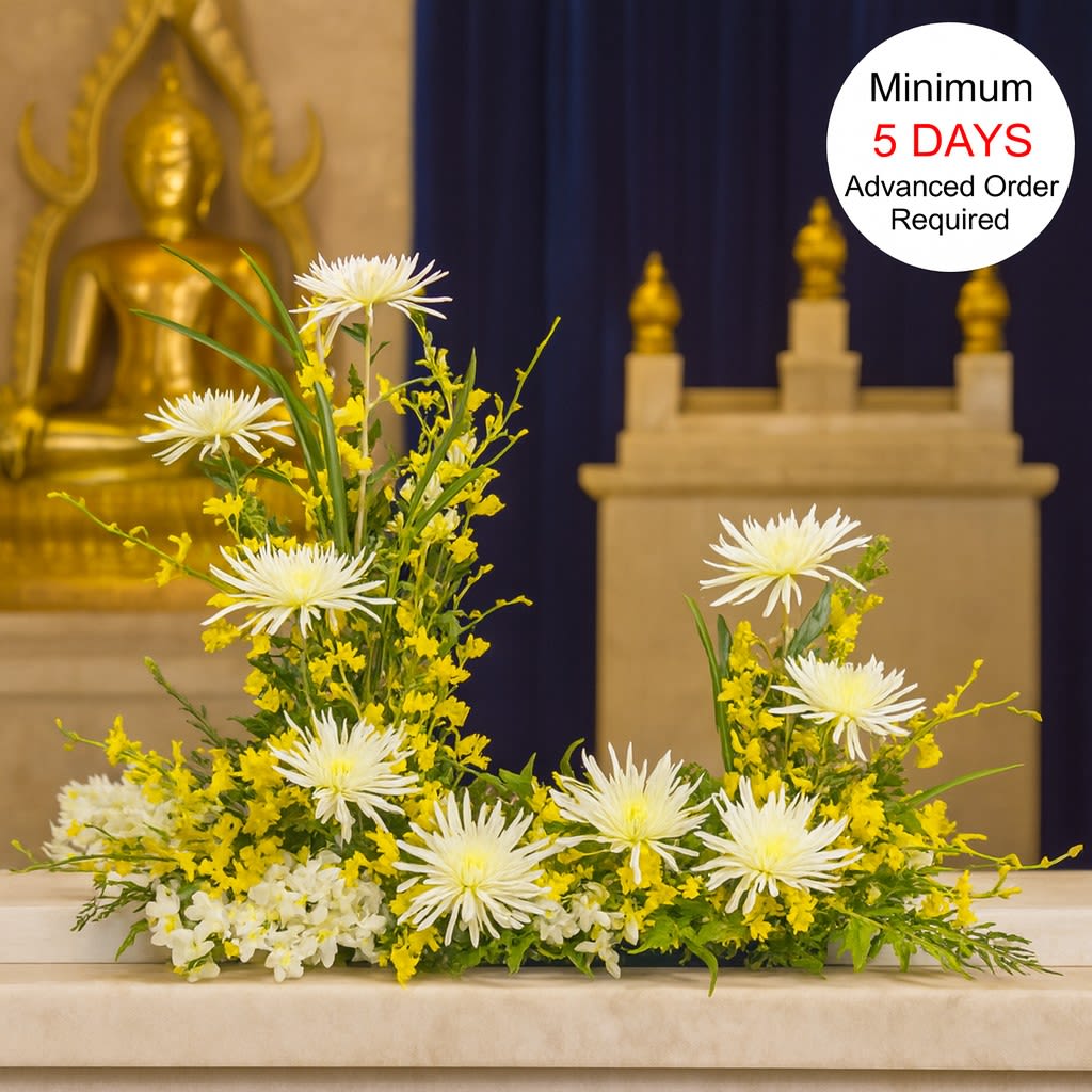 Watanabe Golden Blessings (Urn) - For the person who was golden in life, celebrate their memory with this stunning arrangement full of mums, snapdragons, and orchids, perfect for an urn or picture frame. Measuring approximately 30" high and 34" wide, this arrangement offers a heartfelt and elegant tribute. Please note that a minimum of 5 days' advance notice is required to ensure the flowers can be properly staged for quality results. Photographs with frames (if any) must be no larger than 10" wide and are required to be dropped off at our Kalihi shop 5 days prior to the service.  Key Features:  Stunning Dimensions: Measures approximately 30" high and 34" wide, creating an impressive and elegant display.  High-Quality Arrangement: Expertly crafted with fresh mums, snapdragons, and orchids to ensure lasting beauty and impact.  Elegant Presentation: Perfect for memorials, celebrations of life, or any event where a beautiful and golden tribute is desired.  Meaningful Tribute: Designed to honor and celebrate the life of a loved one who was golden in life with grace and elegance.