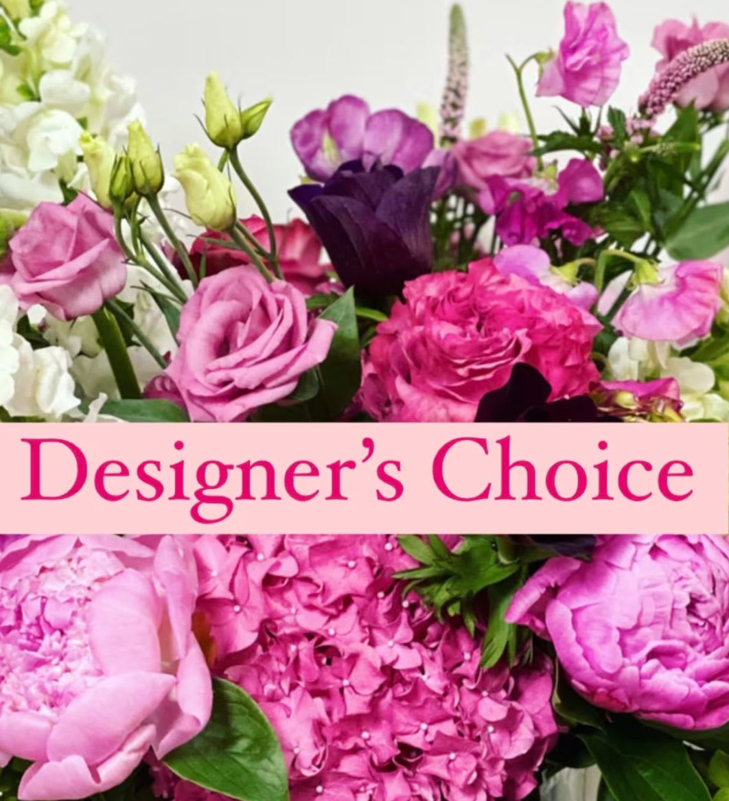 Pink and purple mixed flower bouquet with a Designer's Choice banner