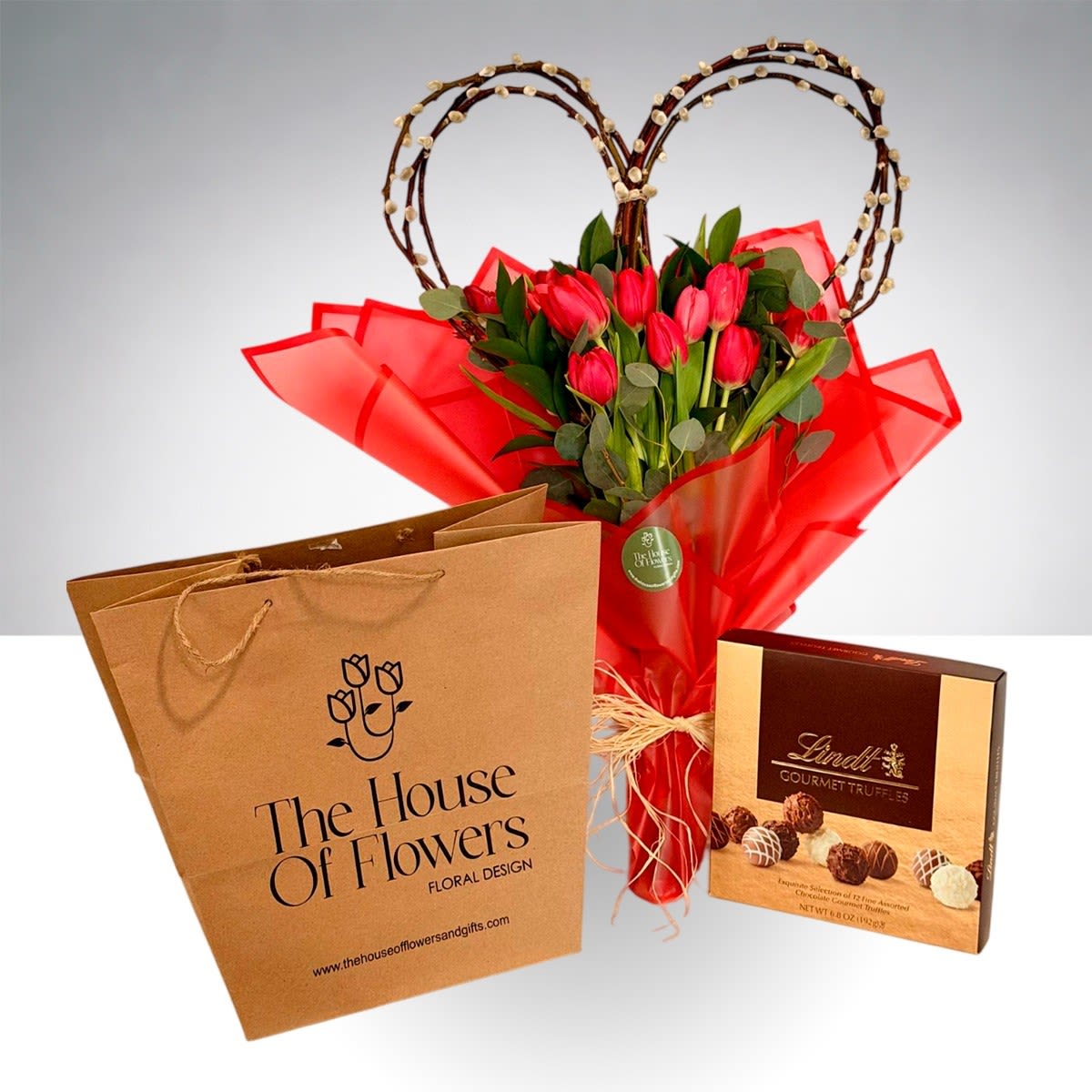 Sweet temptation by The House of Flowers - A beautiful bouquet of tulips with a natural heart-shaped base, perfect for showing your love and devotion to your partner on Valentine's Day, include a box of chocolates LINDT Gourmet Truffles