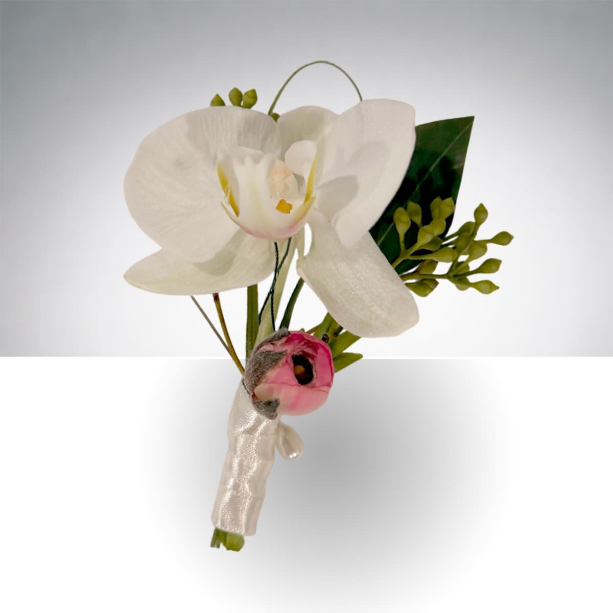 White orchid boutonniere with a small pink accent bloom and ribbon wrap