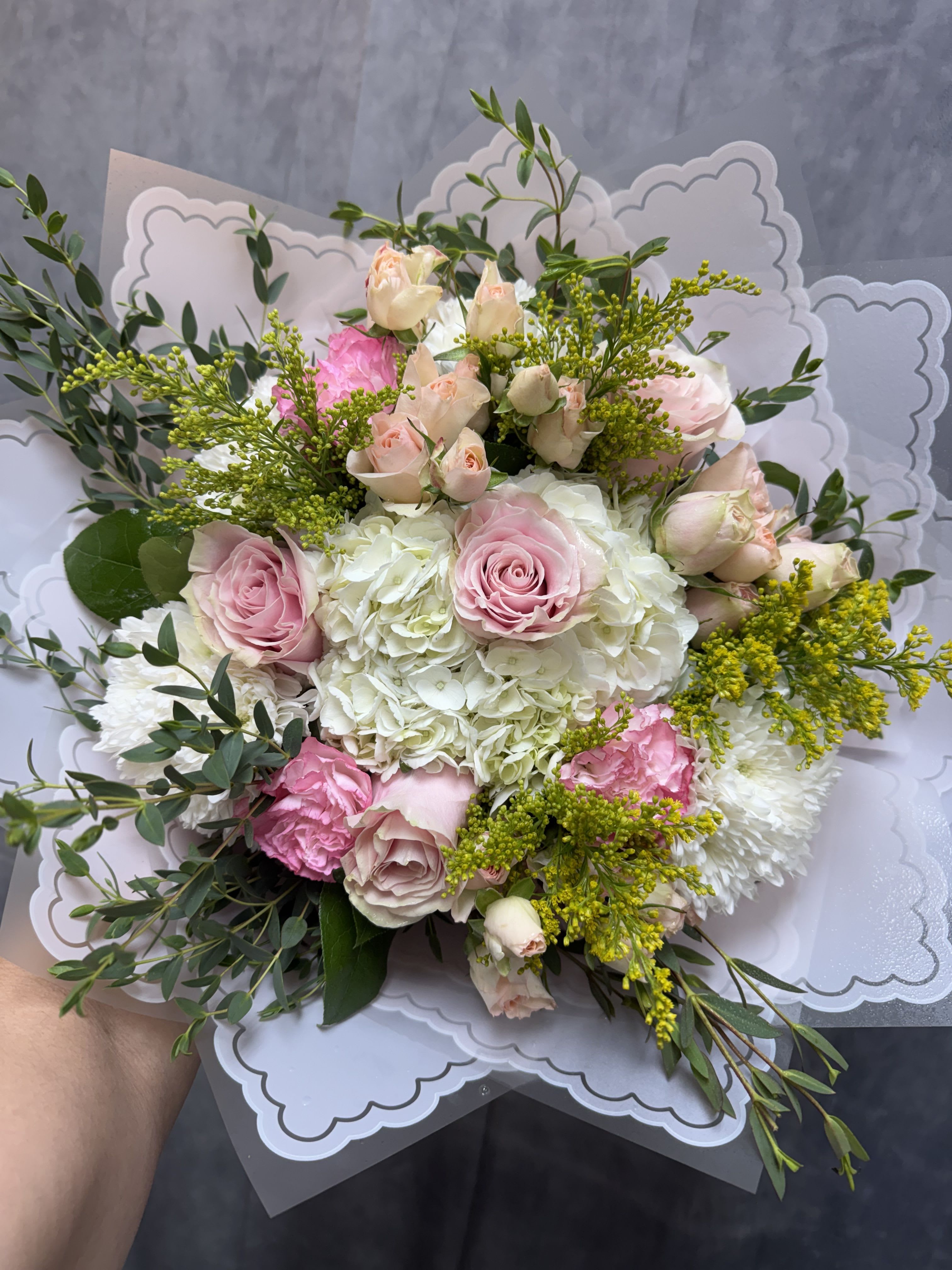 Blushing clouds bouquet - A beautiful bouquet of pink roses &amp; carnations with white hydrangeas , buttons and carnation with greenery. Together, they create a harmonious blend perfect for any occasion. 