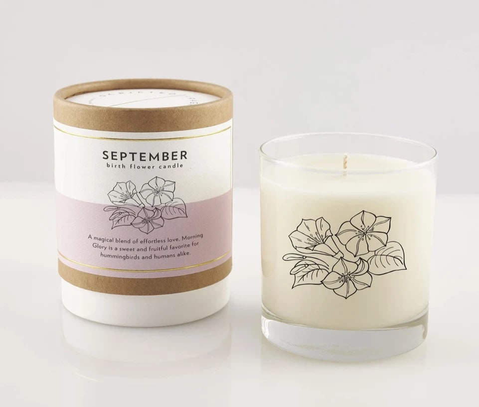 Two September birth flower candles, one in a labeled box and one in a glass jar.