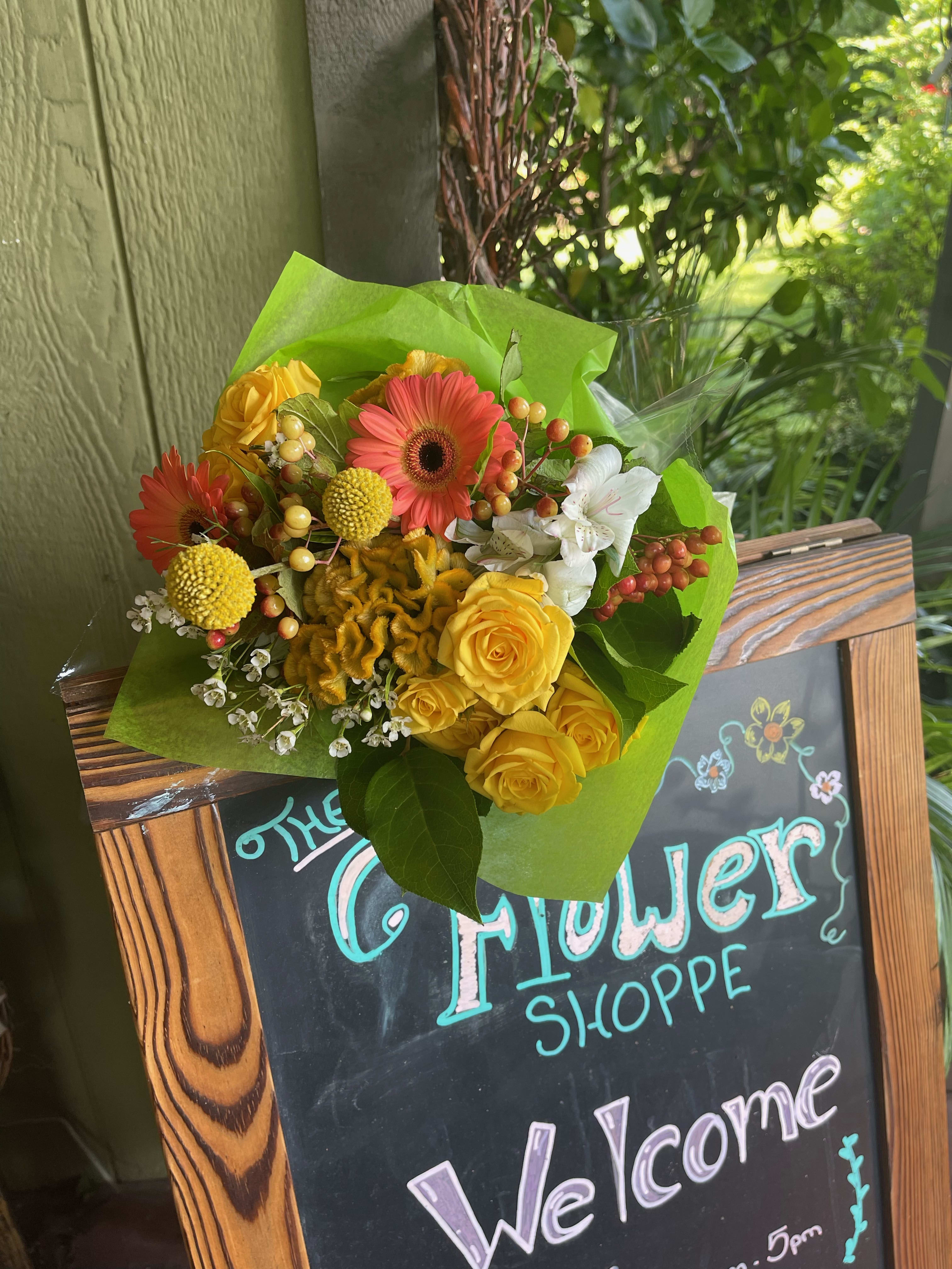 Bouquet of yellow roses, pink gerbera daisies, and white alstroemeria