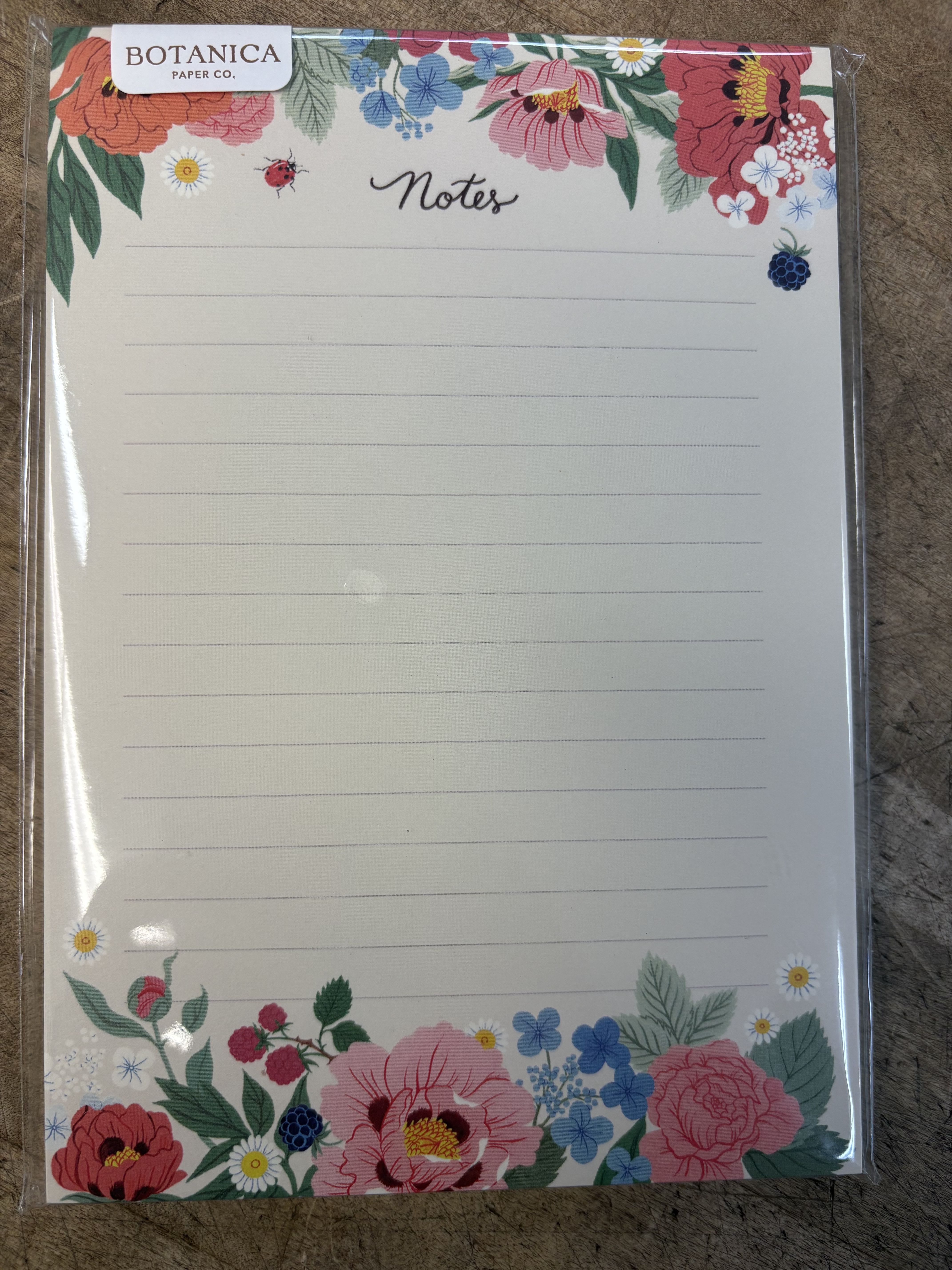 Floral notepad with colorful flower border and lined pages
