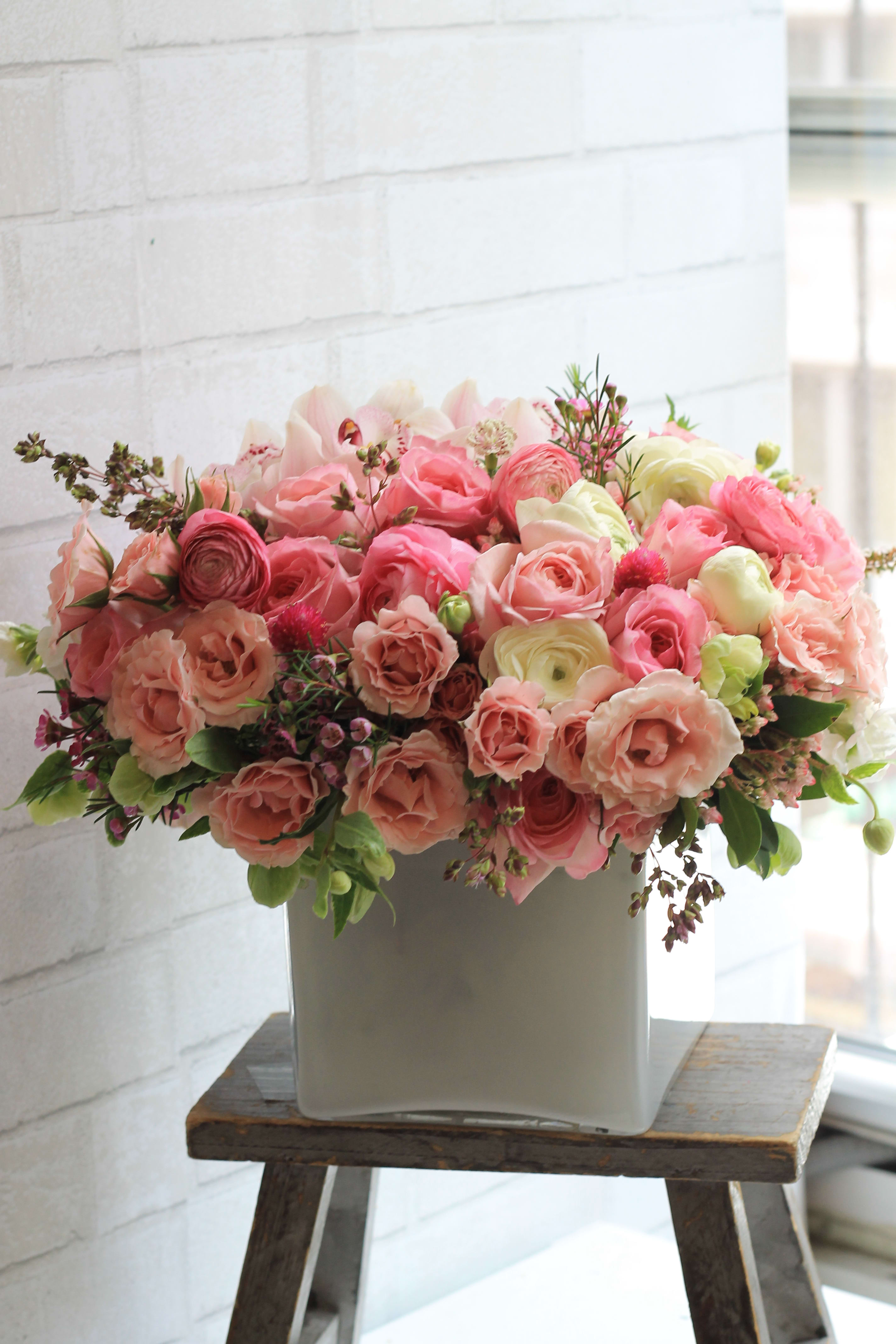 Vogue - Beautiful pastel florals in white glass vase. Send the most beautiful flowers from the best florist in manhattan.