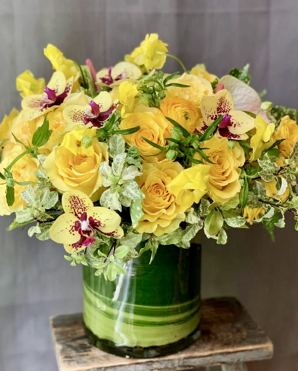 Little Miss Sunshine - Beautiful yellow roses with pink orchids. Classic beauty that will brighten anyone’s day. Send the best flowers from the best florist in New York City. 