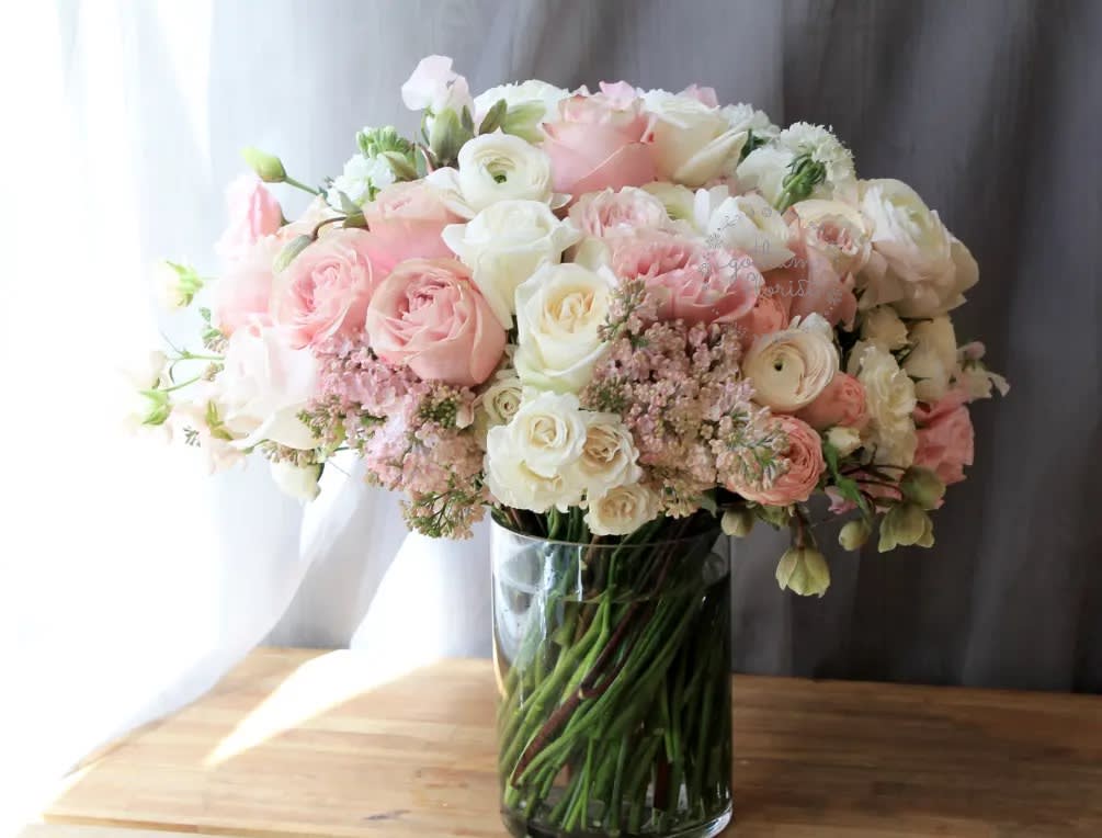 Bébé - Soft pink roses with creamy white roses, elegant ranunculus, sweet pea and lilac. Lush full design.( Please call or email if the design is sold out online)