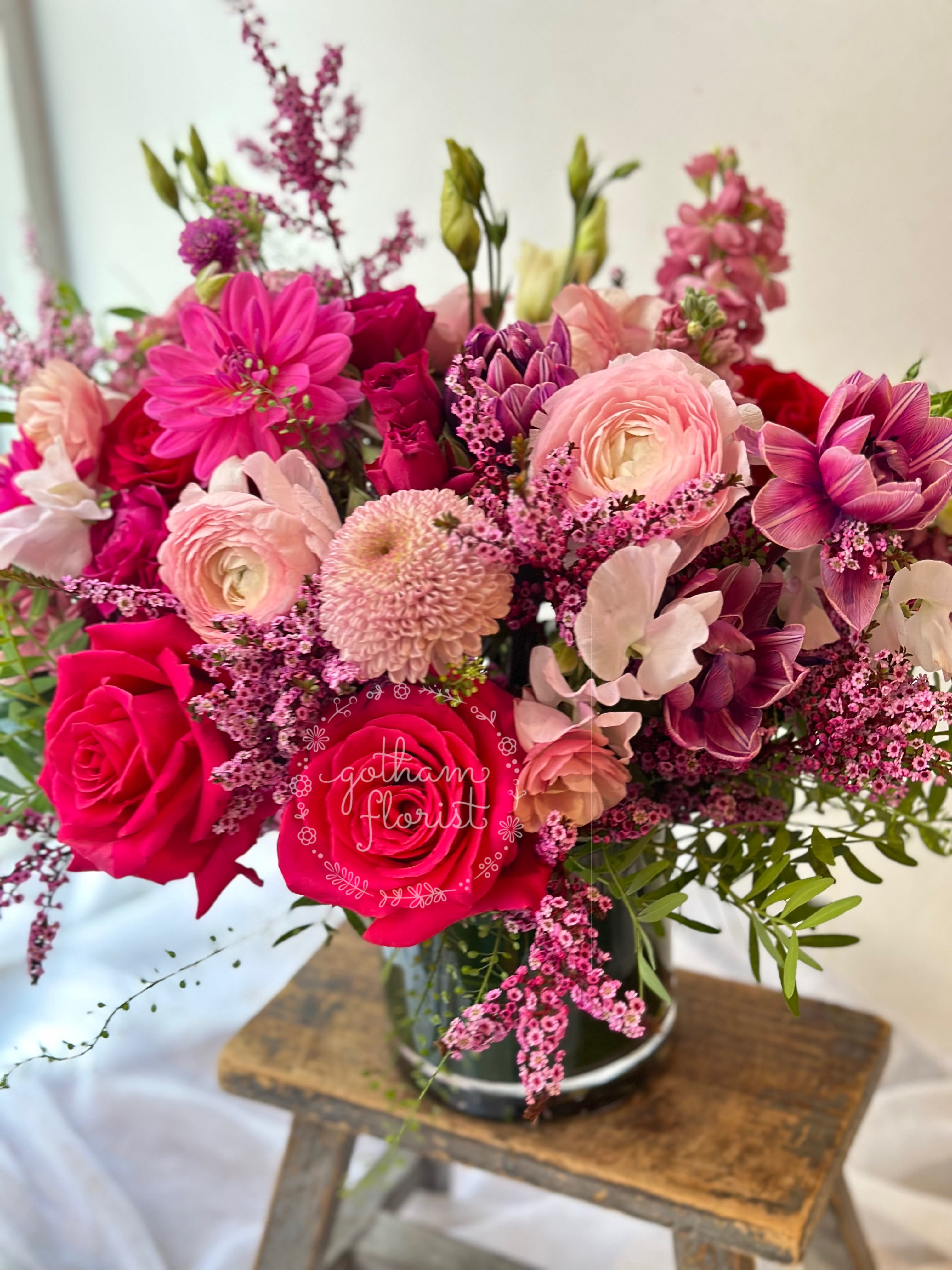 Pink and magenta mixed bouquet in a glass vase