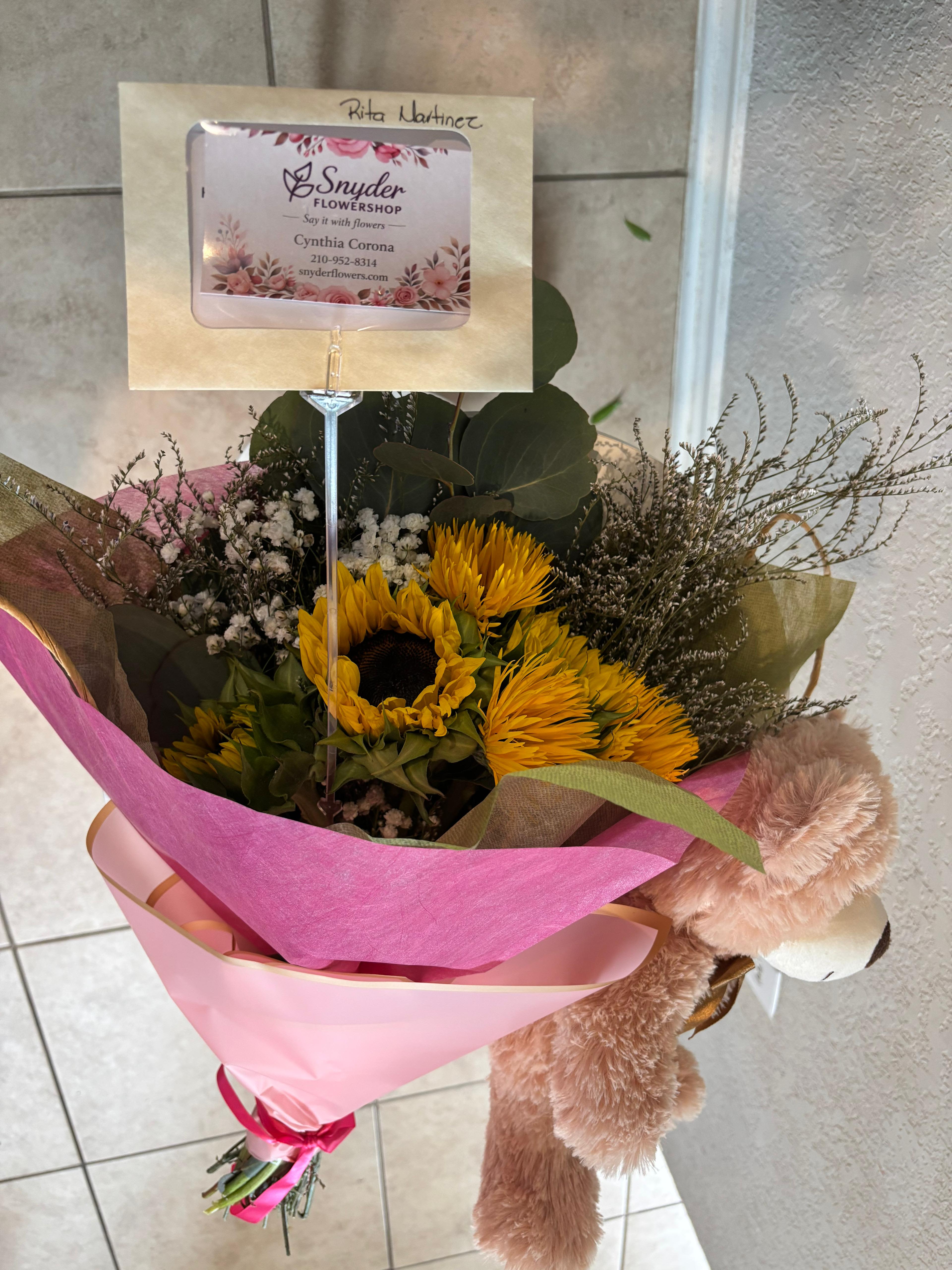 Golden Sunshine Luxury Bouquet - Luxury sunflower and rose bouquet handcrafted with fresh premium flowers by Snyder Flowers in San Antonio. Beautiful bouquet with sunflowers, roses, baby’s breath and elegant wrapping perfect for birthdays, anniversaries, graduations, celebrations and special occasions. We specialize in same day flower delivery in San Antonio with fresh high quality flowers, custom floral arrangements and affordable luxury bouquets made with care and attention to every detail. Local florist in San Antonio offering beautiful fresh flowers, fast delivery and personalized customer service.