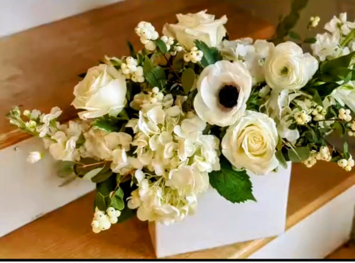Pure White Garden Bouquet - Elegant luxury floral arrangement handcrafted by Snyder Flowers, a local flower shop in San Antonio specializing in same-day flower delivery and premium floral arrangements for sympathy occasions, weddings, anniversaries, birthdays, and events. This beautiful white arrangement includes fresh roses, hydrangeas, anemones, ranunculus, and seasonal flowers designed with modern elegant floral styling and premium quality blooms. Affordable flower delivery in San Antonio with personalized floral design and fresh flowers for every special occasion.