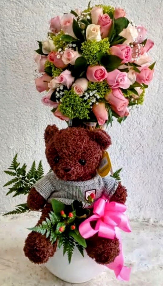 Sweet Teddy Rose Garden - Luxury romantic flower arrangement with teddy bear by Snyder Flowers in San Antonio, Texas featuring fresh pink roses, premium seasonal flowers, elegant greenery, and a beautiful teddy bear gift designed for anniversaries, birthdays, Valentine’s Day, baby showers, romantic surprises, and special occasions. Our San Antonio florist specializes in same-day flower delivery, luxury floral arrangements, fresh roses, orchids, tulips, lilies, sympathy flowers, graduation flowers, and custom handcrafted bouquets made with premium quality flowers at affordable prices. Looking for the best florist in San Antonio? Snyder Flowers offers elegant flower arrangements, romantic gifts, same-day flower delivery, and beautiful floral designs for every occasion.