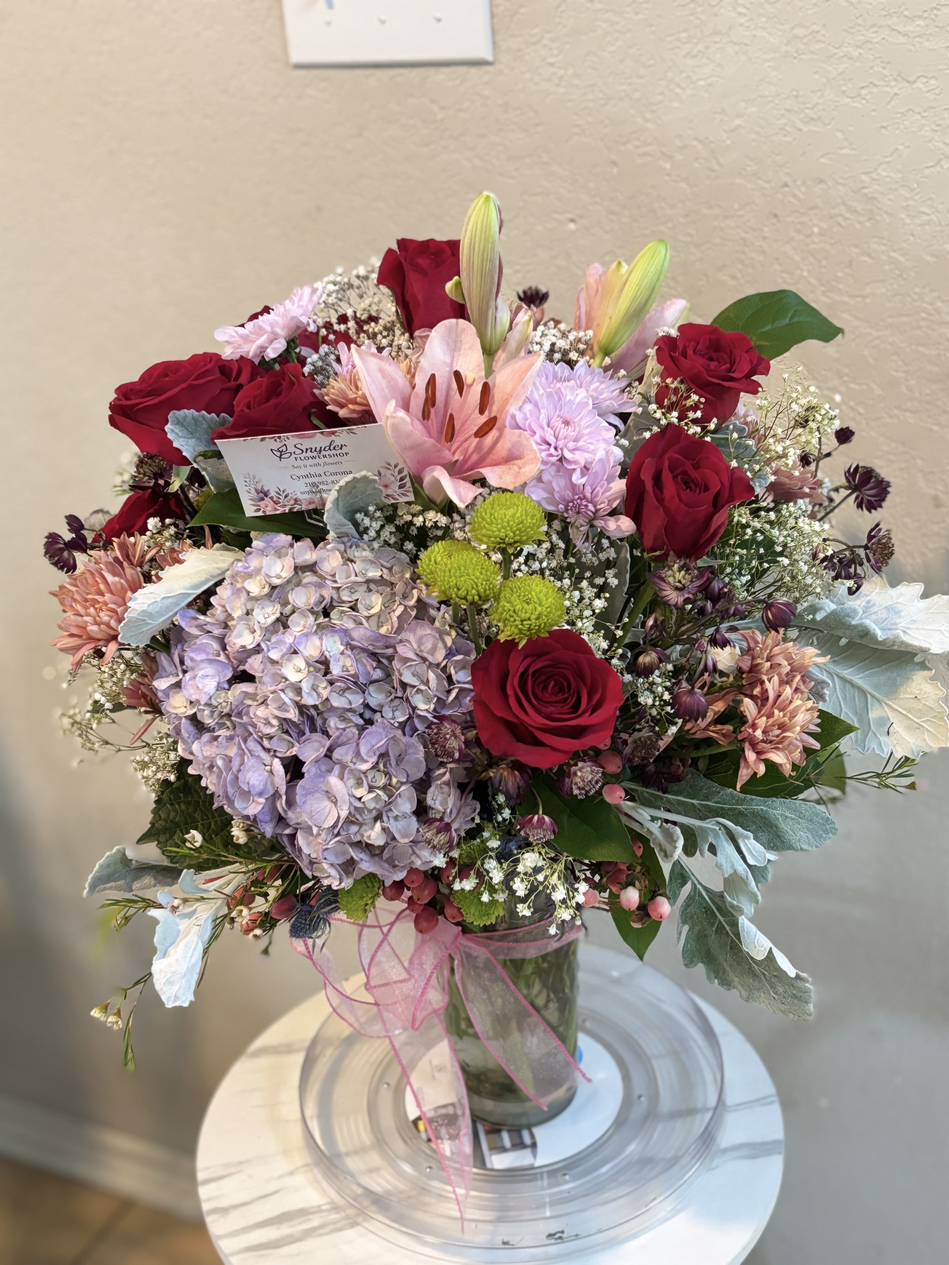 Luxury Hydrangea &amp; Red Roses Elegance - Luxury flower arrangement in San Antonio featuring premium red roses, soft hydrangeas, pink lilies, chrysanthemums and fresh seasonal flowers handcrafted by Snyder Flower Shop. Elegant floral bouquet designed for anniversaries, birthdays, romantic surprises, sympathy flowers, Mother’s Day and special occasions with same day flower delivery in San Antonio TX. Our local florist specializes in luxury roses, hydrangea arrangements, fresh lilies and custom floral designs made with high quality flowers at affordable prices. Same day flower delivery available throughout San Antonio and surrounding areas.