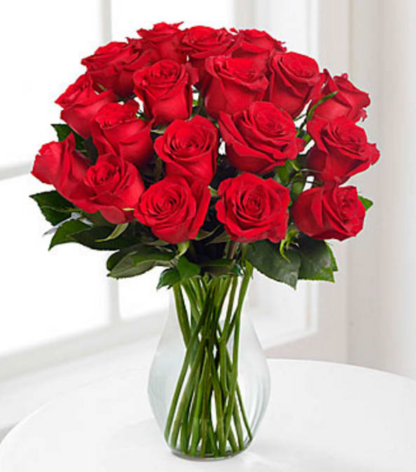 Red Long Stem Roses - VASE INCLUDED - Picked fresh from the farm to offer your special recipient a gift straight from the heart, our stunning Red Rose Bouquet is a classic romantic gesture that will have them falling head over heels in love with each exquisite bloom. Hand gathered in select floral farms and flaunting a rich red hue accented with pops of white starry gypsophilia , this stunning flower arrangement has been picked fresh for you to help you celebrate a birthday, anniversary, or convey your message of love and sweet affection. This bouquet includes the following: red roses, gypsophilia, and an assortment of lush greens. Available with a wide variety of vases to suit your every gifting need. GOOD bouquet is approximately 14"H x 10"W. BETTER bouquet is approximately 16"H x 12"W. BEST bouquet is approximately 20"H x 16"W. *50cm Roses are reduced to be proportionate to the vase, providing a good customer experience Your purchase includes a complimentary personalized gift message.