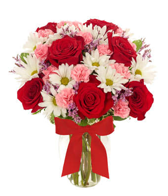 Sweetest Medley Bouquet - Surely you will sweep someone off their feet the moment they set their eyes on this breathtaking orchestration of botanical beauty. Roses, mini carnations, daisies and limonium are the starring blooms while a graceful clear vase sets the stage.