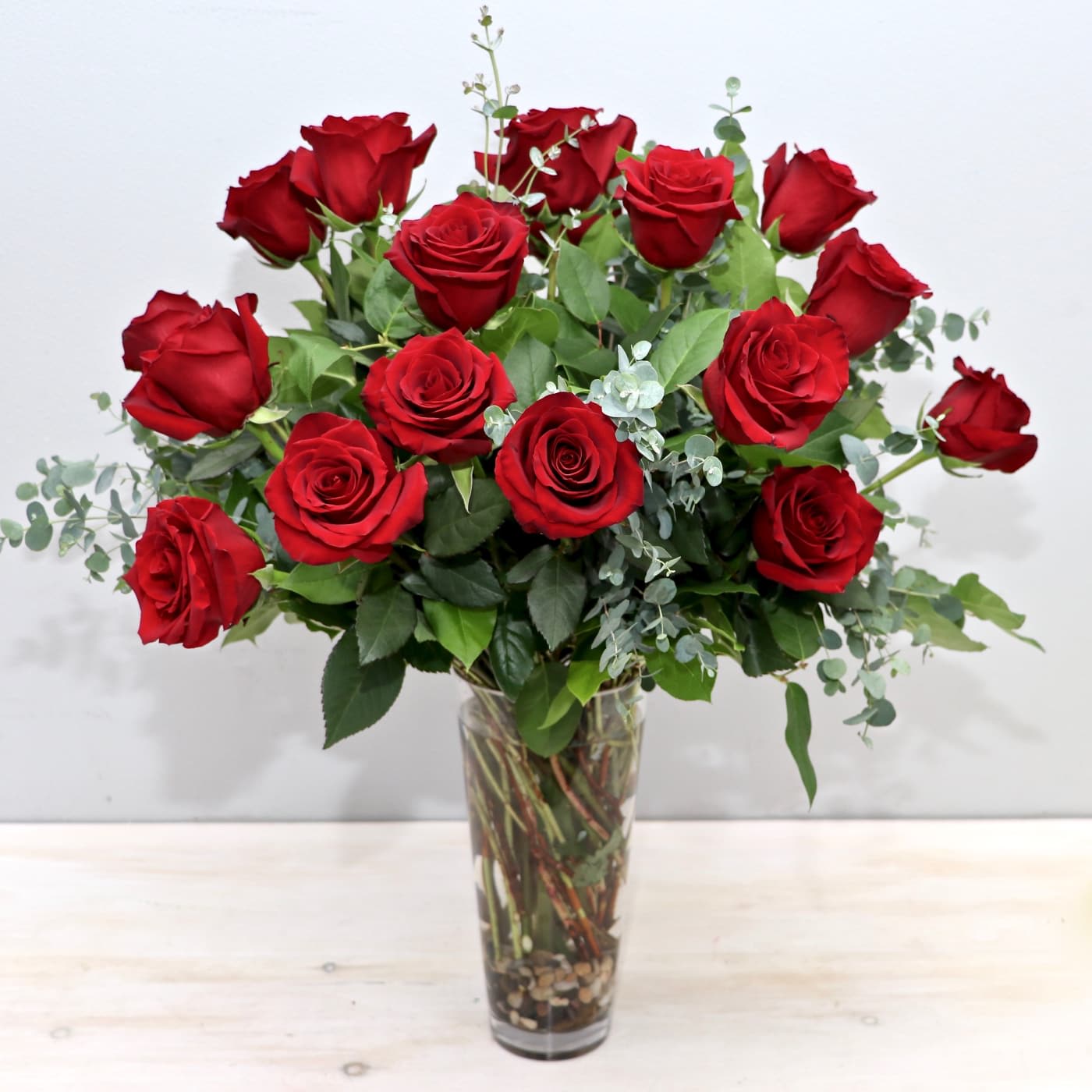 Bouquet of red roses in a clear glass vase