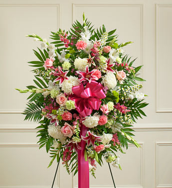 Deepest Sympathies Pastel Standing Spray -  Product ID: 91408   Convey your deepest sympathies and continued support with this vibrant standing spray. Expertly crafted by our local florists from an assortment of pastel blooms, itâs a comforting way to let them know youâre thinking of them during a difficult time. Standing spray arrangement of fresh pastel roses, lilies, mums, gladiolas, snapdragons, Bells of Ireland, carnations, heather and more Appropriate for family, friends or business associates to send directly to the funeral home Our florists use only the freshest flowers available so colors and varieties may vary Large measures approximately 56"H x 42"L without easel Medium measures approximately 46"H x 38"L without easel Small measures approximately 42"H x 32"L without easel Easel may not be available in all areas