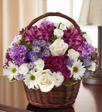 Peace, Prayers, &amp; Blessings- Lavender and White - Product ID: 95425   Express your heartfelt sympathy with a graceful arrangement of peaceful lavender and white blooms such as roses, stock, alstroemeria and more. Designed by hand in a lovely basket, it's a beautiful tribute to a life well lived. Graceful lavender and white arrangement of roses, stock, alstroemeria, daisy poms, mini carnations and monte casino, accented with variegated pittosporum and myrtle Hand-arranged in a willow handled basket; measures 8"H Appropriate to send to the home of friends and family members or to the memorial service Large arrangement measures approximately 12"H x 12"L Medium arrangement measures approximately 11"H x 11"L Small arrangement measures approximately 10"H X 10"L Our florists hand-design each arrangement, so colors, varieties, and basket may vary due to local availability days