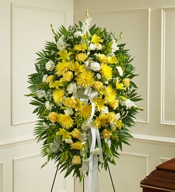 Deepest Sympathies Yellow Standing Spray - Product ID: 91284   During times of loss, it can be hard to express exactly what youâre feeling in your heart. Let this beautiful standing spray arrangement of fresh yellow blooms, which signify friendship, and white blooms, which signify remembrance, help you convey your care and concern when words alone canât. Standing spray arrangement of fresh yellow and white flowers such as roses, Asiatic lilies, gladiolas, carnations and more Appropriate for family, friends or business associates to send directly to the funeral home Our florists use only the freshest flowers available, so colors and varieties may vary Large measures approximately 50âH x 42âL without easel Medium measures approximately 46âH x 38â L without easel Small measures approximately 42"H x 32"L without easel