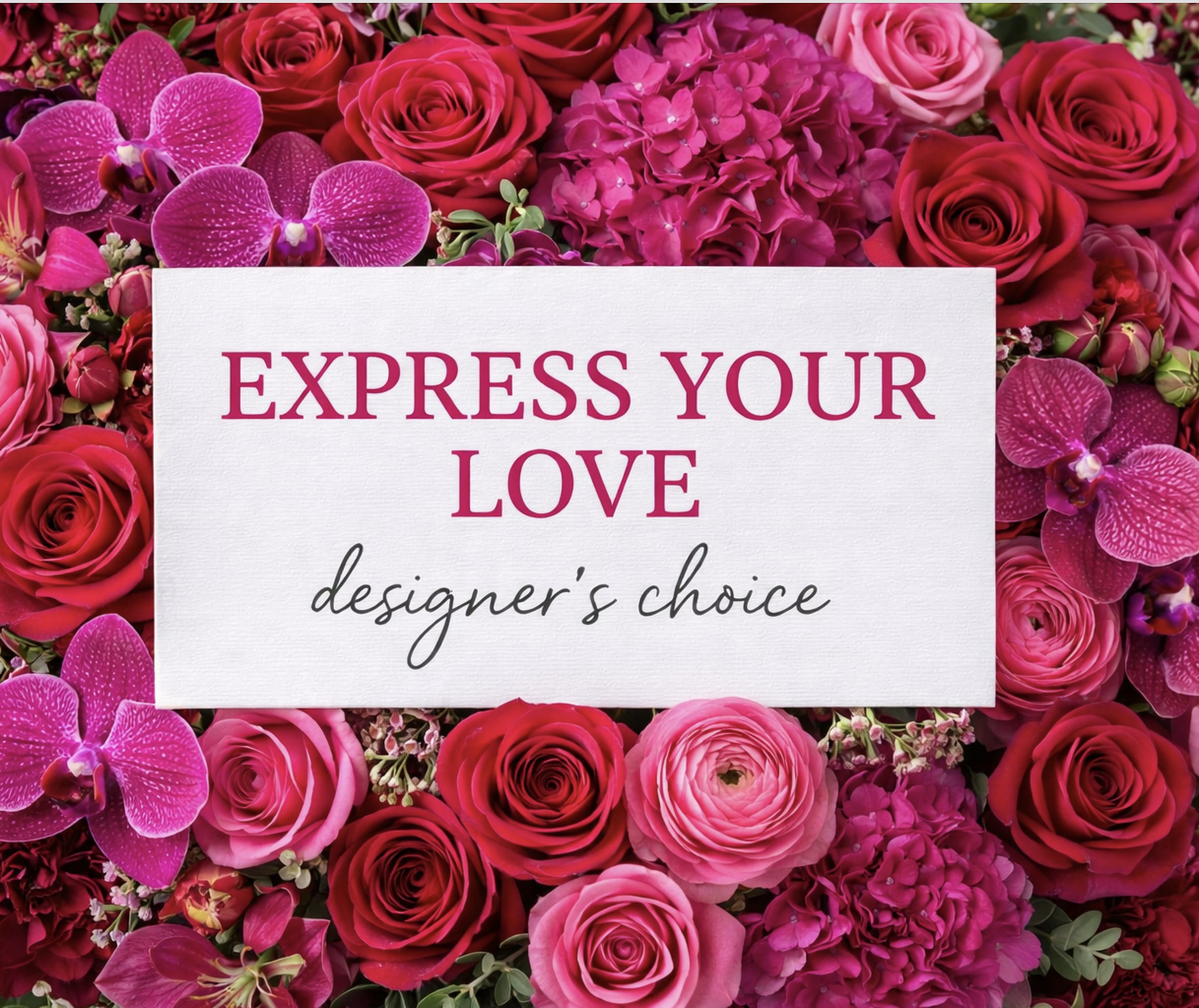 Pink and red roses with orchids around a love message card