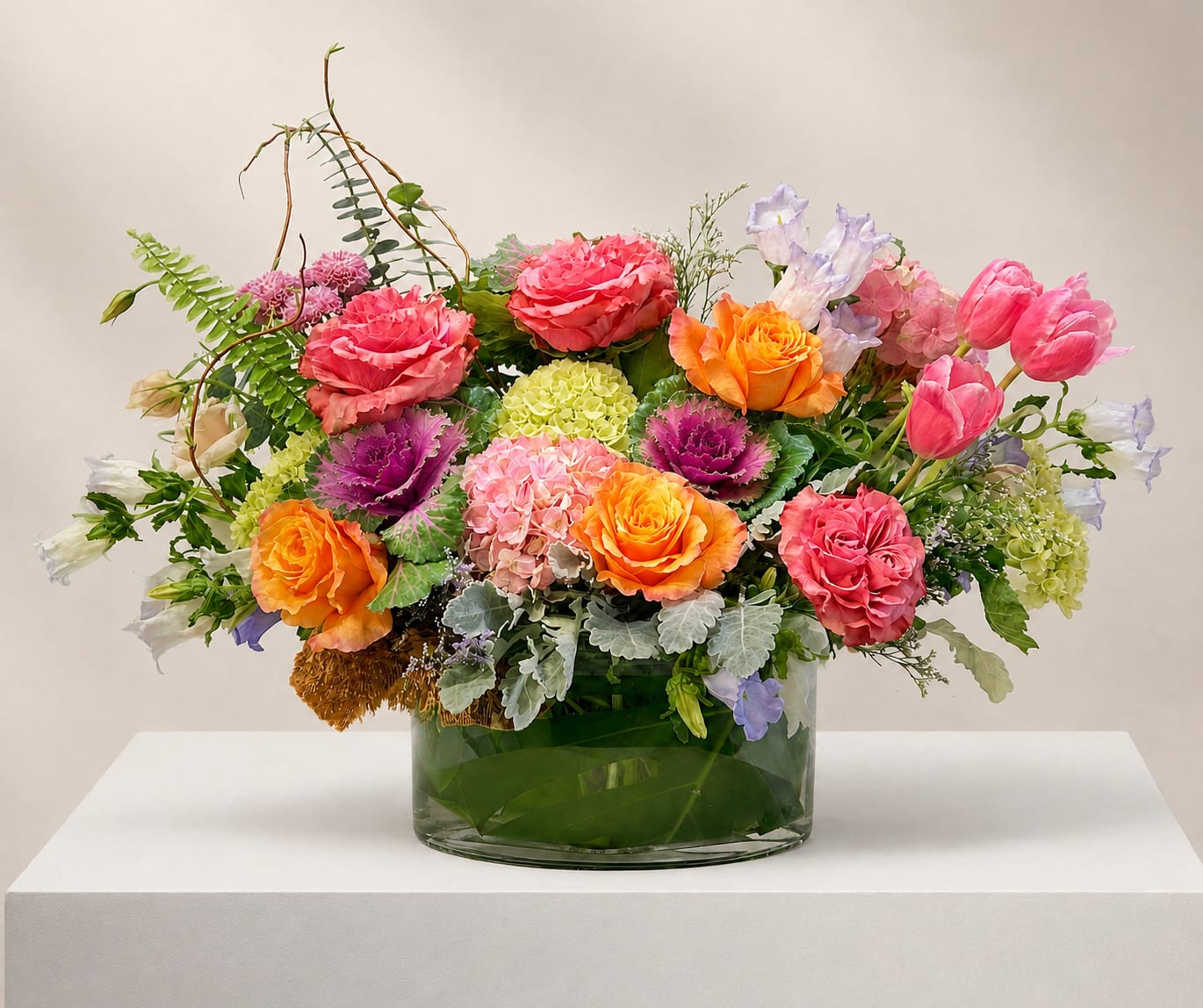 Colorful mixed flower arrangement in a glass vase