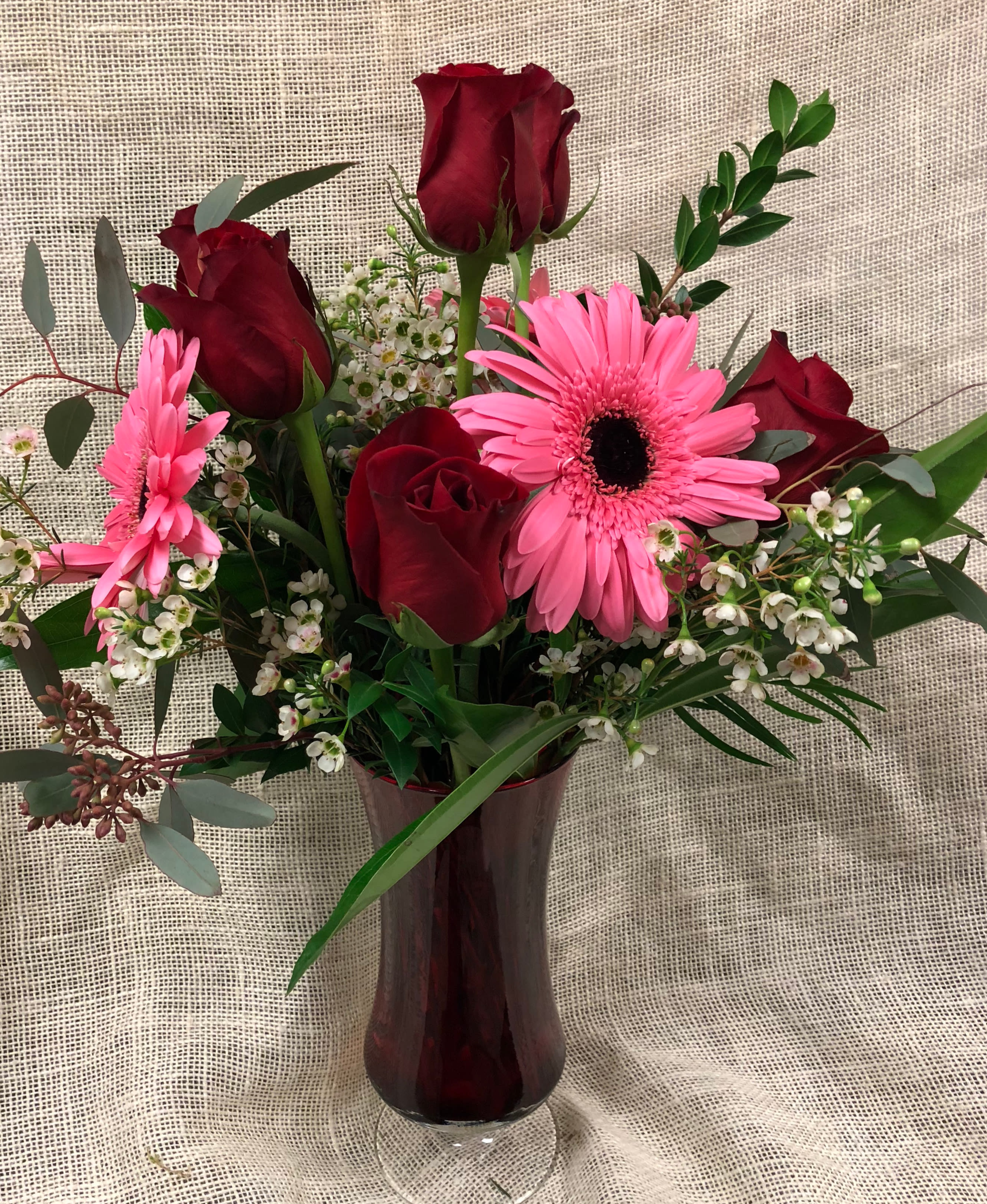 My Girl- Red Roses and Gerbera Daisies - AVAILABLE Feb 12-14 Express your devotion to your own "My Girl" with this lovely arrangement of 6 red roses and 3 Valentine-colored gerbera daisies designed with greens and accompanying accents. To boost the "wow" factor, upgrade to Deluxe (9 roses, 5 gerbs) or Premium (a dozen roses plus 6 gerbs)
