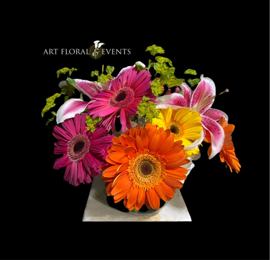 Bright gerbera and lily bouquet in a vase