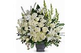 White floral arrangement in a dark vase
