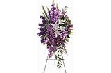Purple floral arrangement in a clear vase