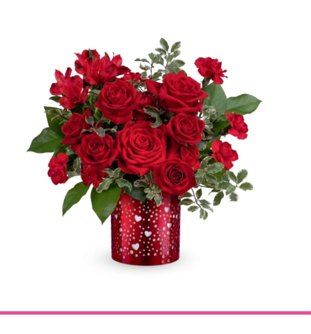 Red roses and carnations in a heart-patterned red vase