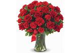 Large bouquet of red roses in a clear glass vase