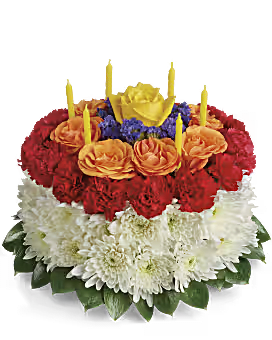Tiered floral cake with candles in red, orange, white, and yellow blooms