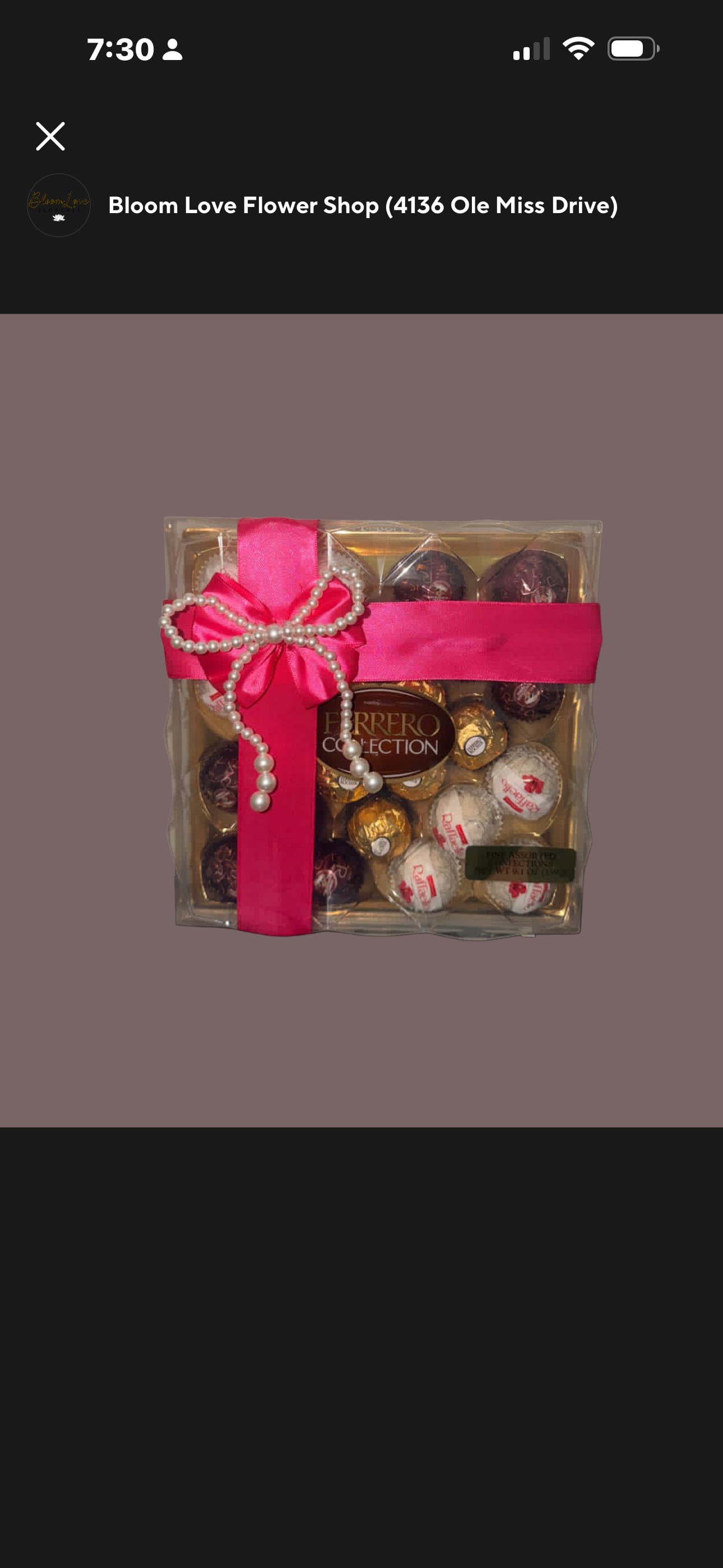 Box of Ferrero Rocher chocolates tied with a pink ribbon and pearl bow