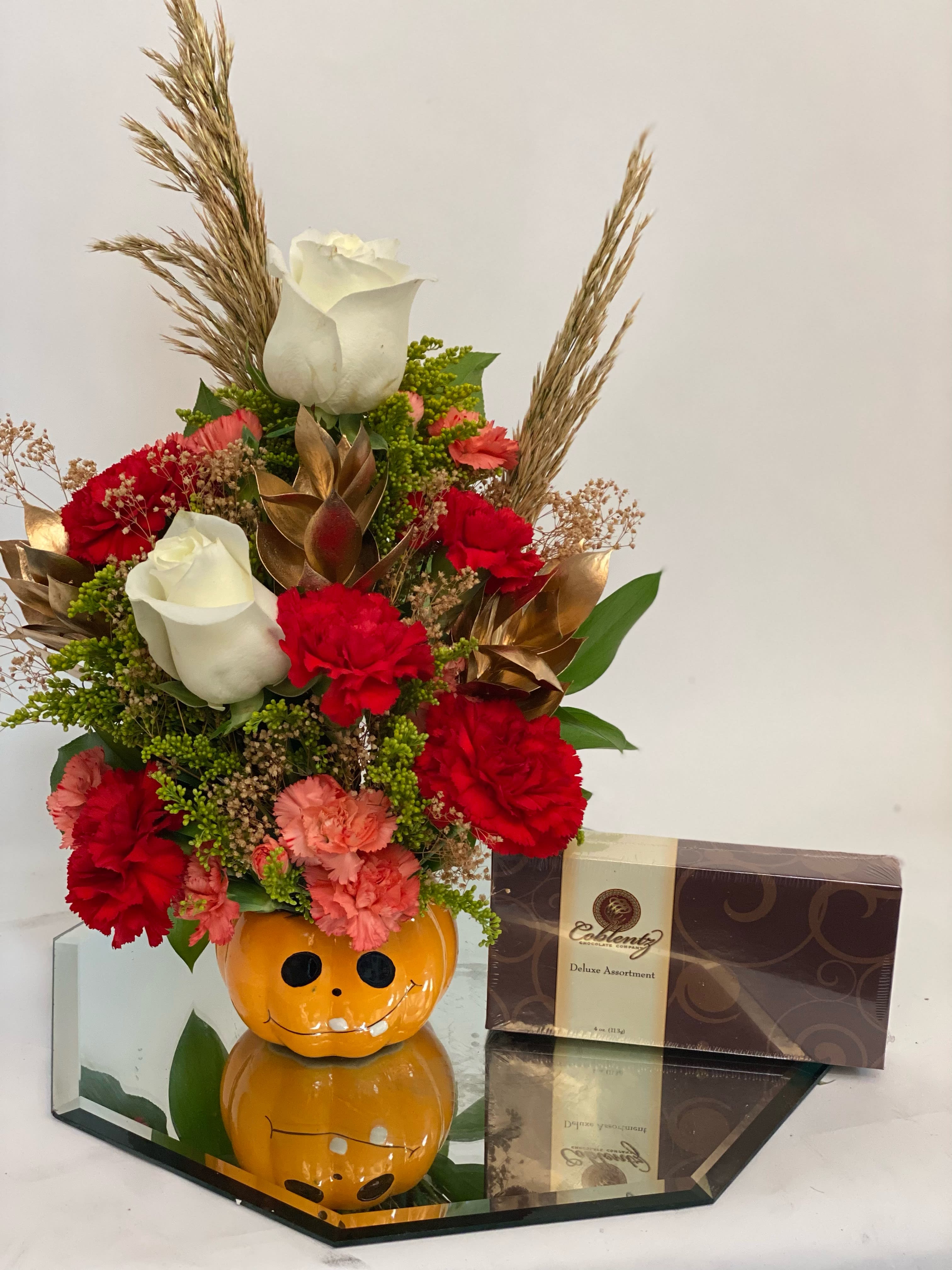Jackie lantern w/ chocolates - Cute small ceramic pot, yes chocolates are included 