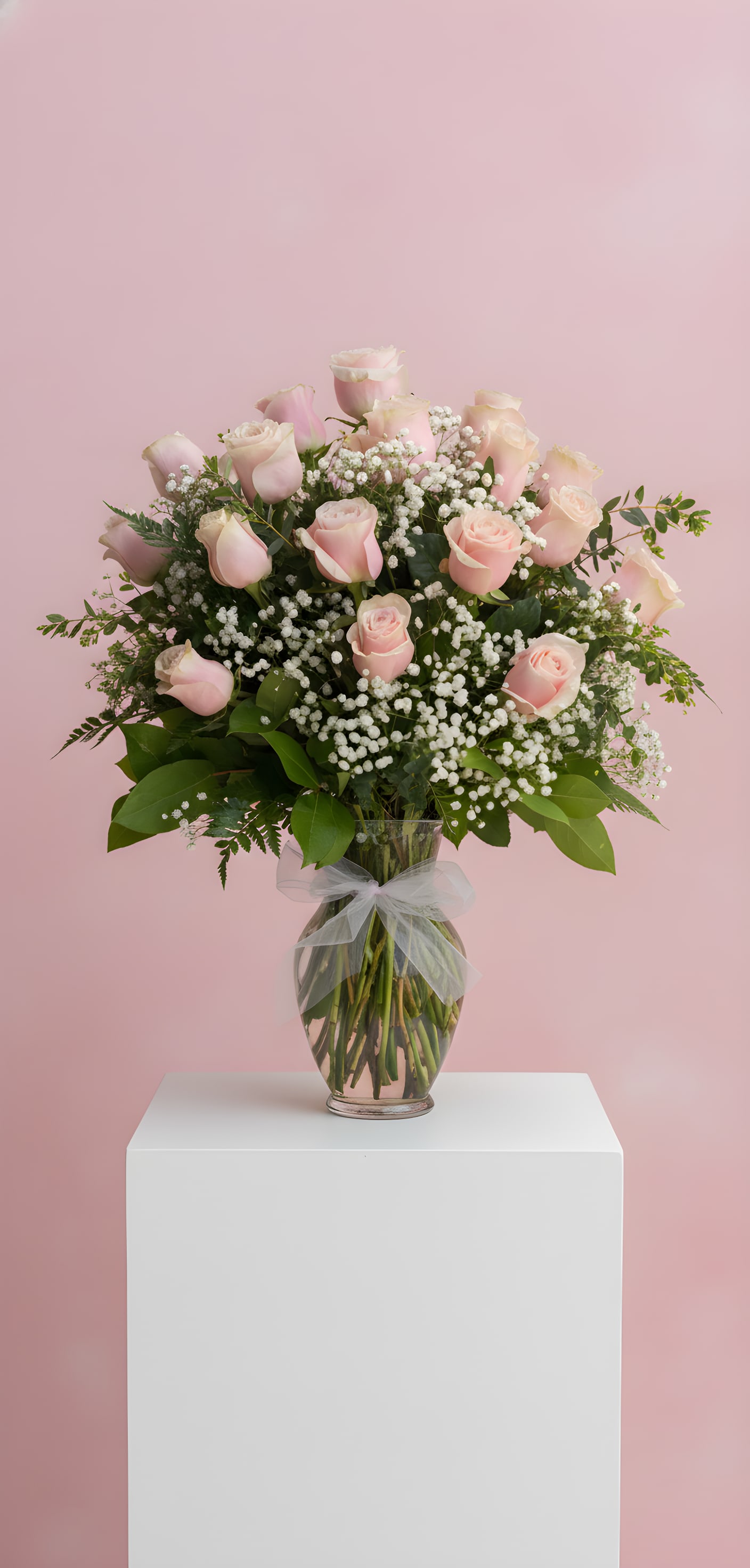 Rose Era - 2 Dozen pink roses with baby's breath and mixed foliage, designed all the way around for a full view and elegance to fill the room. 