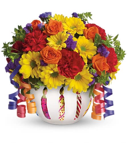 Brilliant Birthday Blooms - Birthday wishes can come true even before the cake is served when you send this brilliant arrangement! Bright flowers fill a frosted glass bowl that's adorned with a shiny birthday candle motif. It makes a beautiful party centerpiece and a thoughtful gift! Pretty orange spray roses red miniature carnations yellow daisy spray chrysanthemums purple statice and more are joined by yards of curling ribbon and delivered in a very special keepsake container. Brilliant? You bet!Approximately 11 1/4" W x 10 1/2" H 