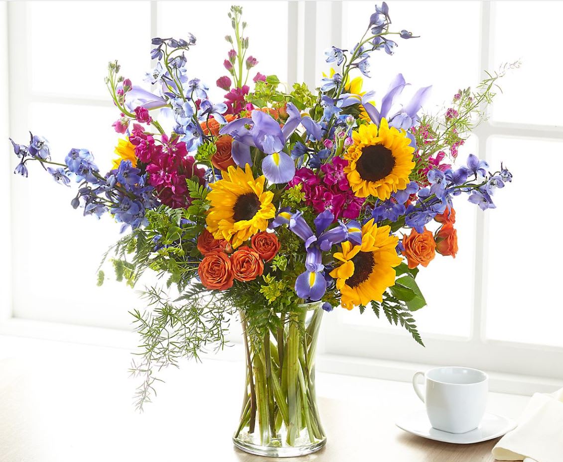 Rays of Life™ Bouquet - Show your loved ones how much you care about them with a beautiful bouquet full of bright summer florals. Our Rays of Light™ Bouquet arrives handcrafted with sunflowers and a seasonal mix of colorful blooms.  The result is a vivid blend.   
