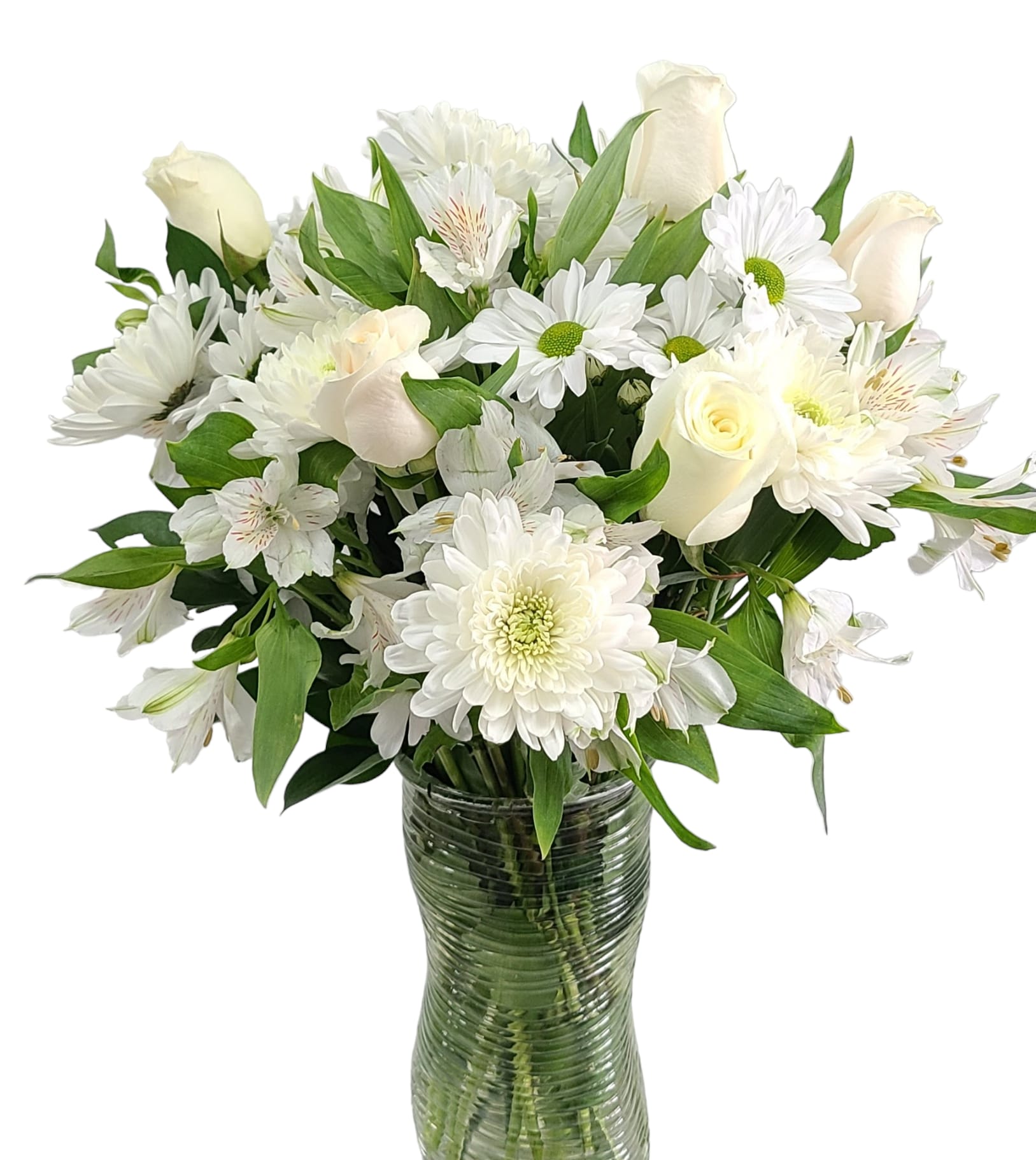 White roses and daisies arranged in a glass vase