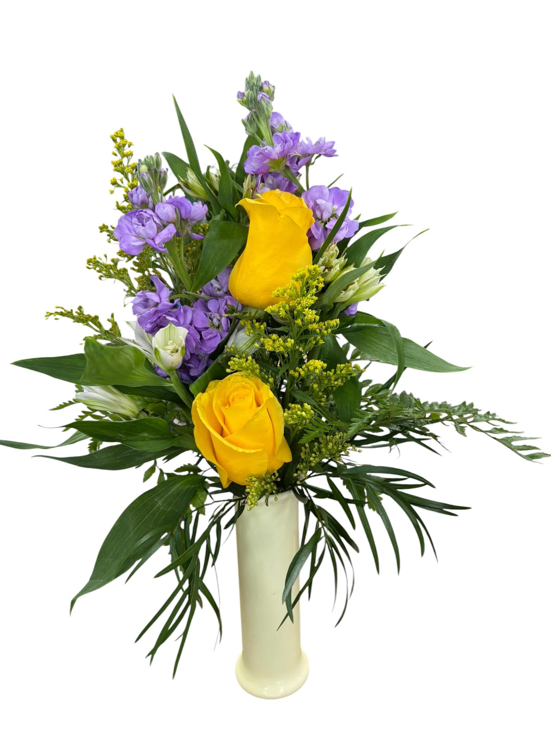 Yellow roses and purple flowers arranged in a tall white vase