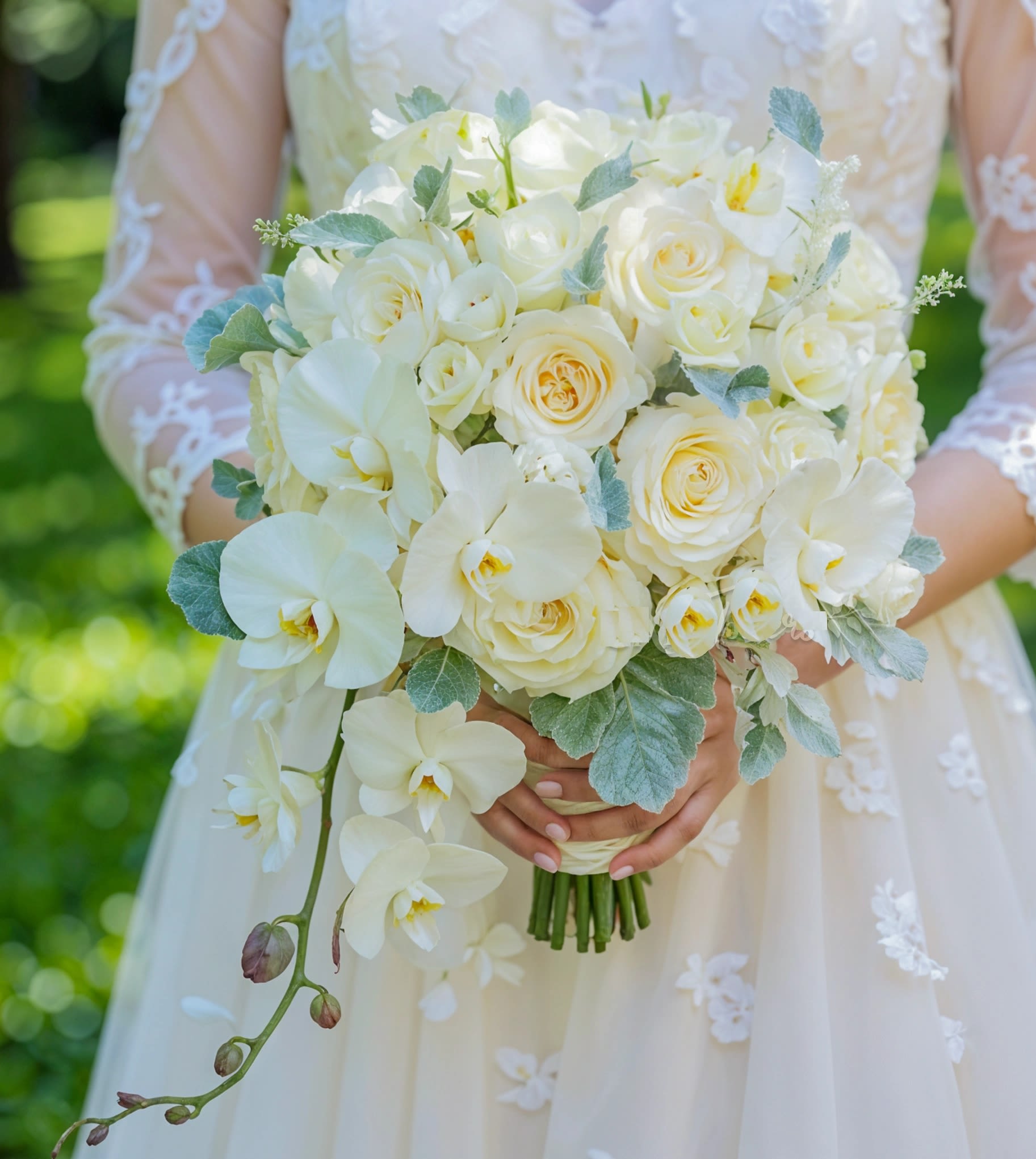 Elegant bridal hand-tied bouquet  - This elegant bridal hand-tied bouquet features  stunning white phalaenopsis orchid,  pristine white roses, and  delicate white lisianthus, all beautifully complemented by fresh green fillers. The combination of luxurious white orchids, roses, and lisianthus creates a sophisticated and timeless bouquet, perfect for a bride seeking elegance and purity on her wedding day.